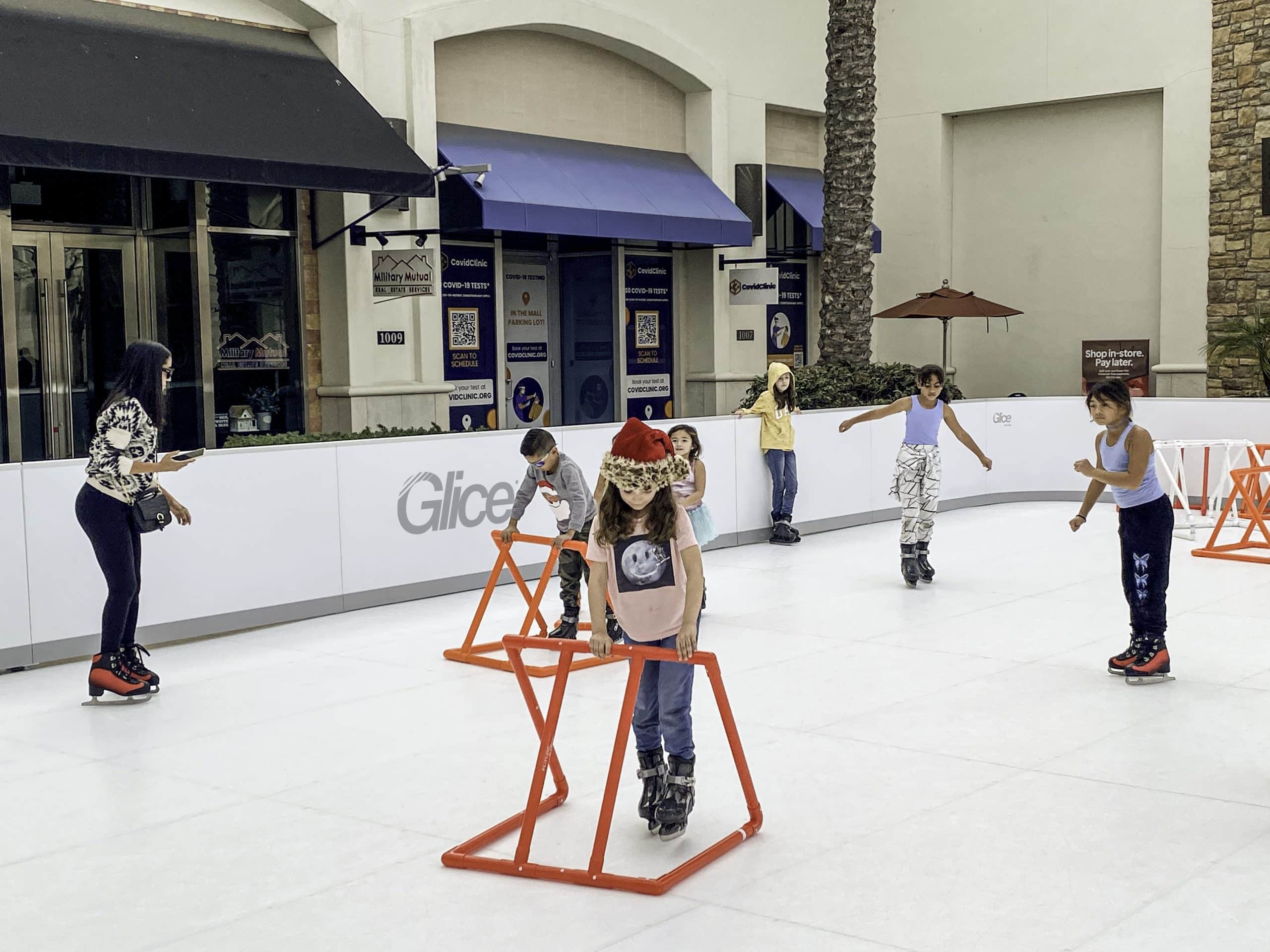 Kids skating on synthetic ice