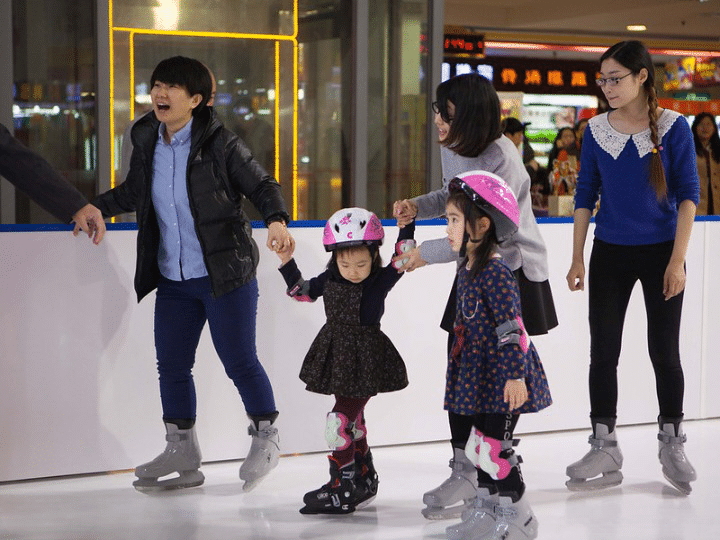 Family ice skating together