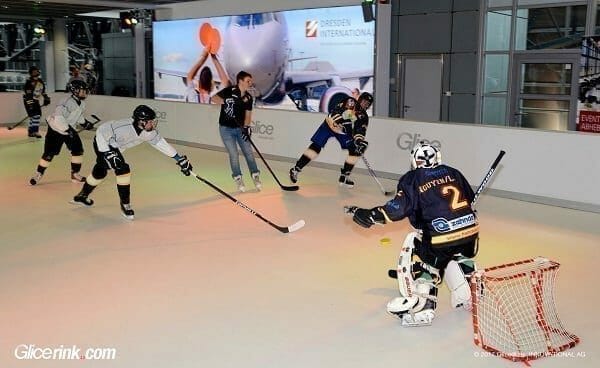 Hockey players practicing on a Glice, the best synthetic ice