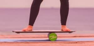 Person working out on balance board - lower legs in shot