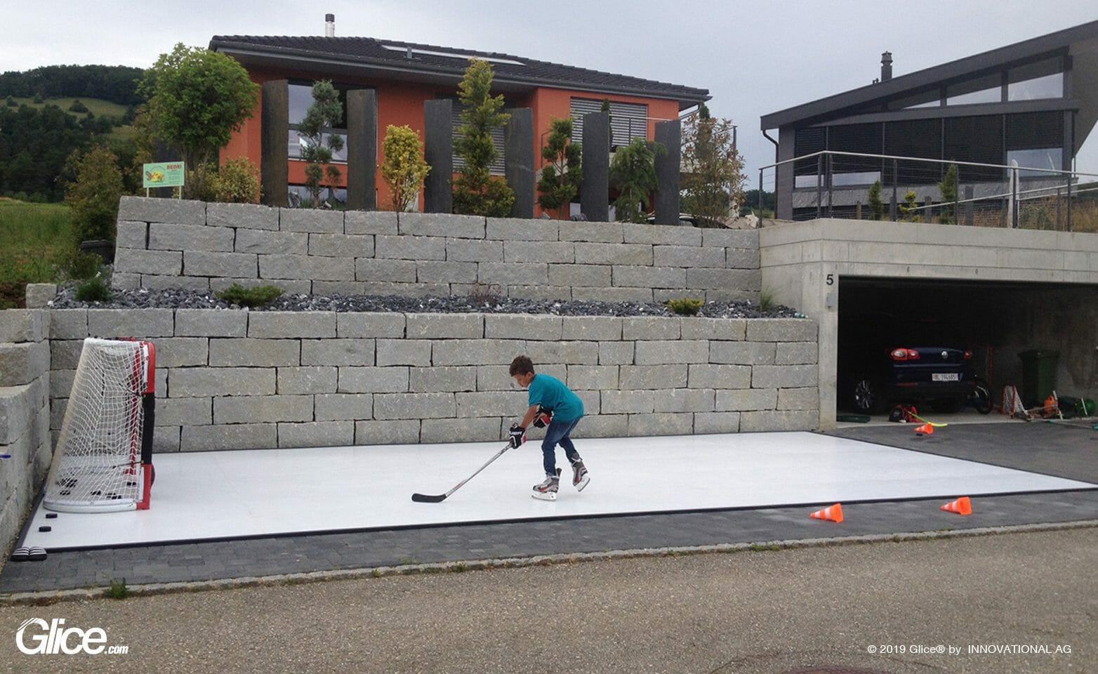 A boy training on ice in the backyard