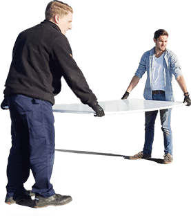 Two men carrying a large synthetic ice tile