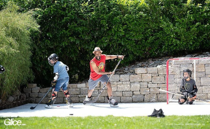 People playing ice hockey outdoors in summer